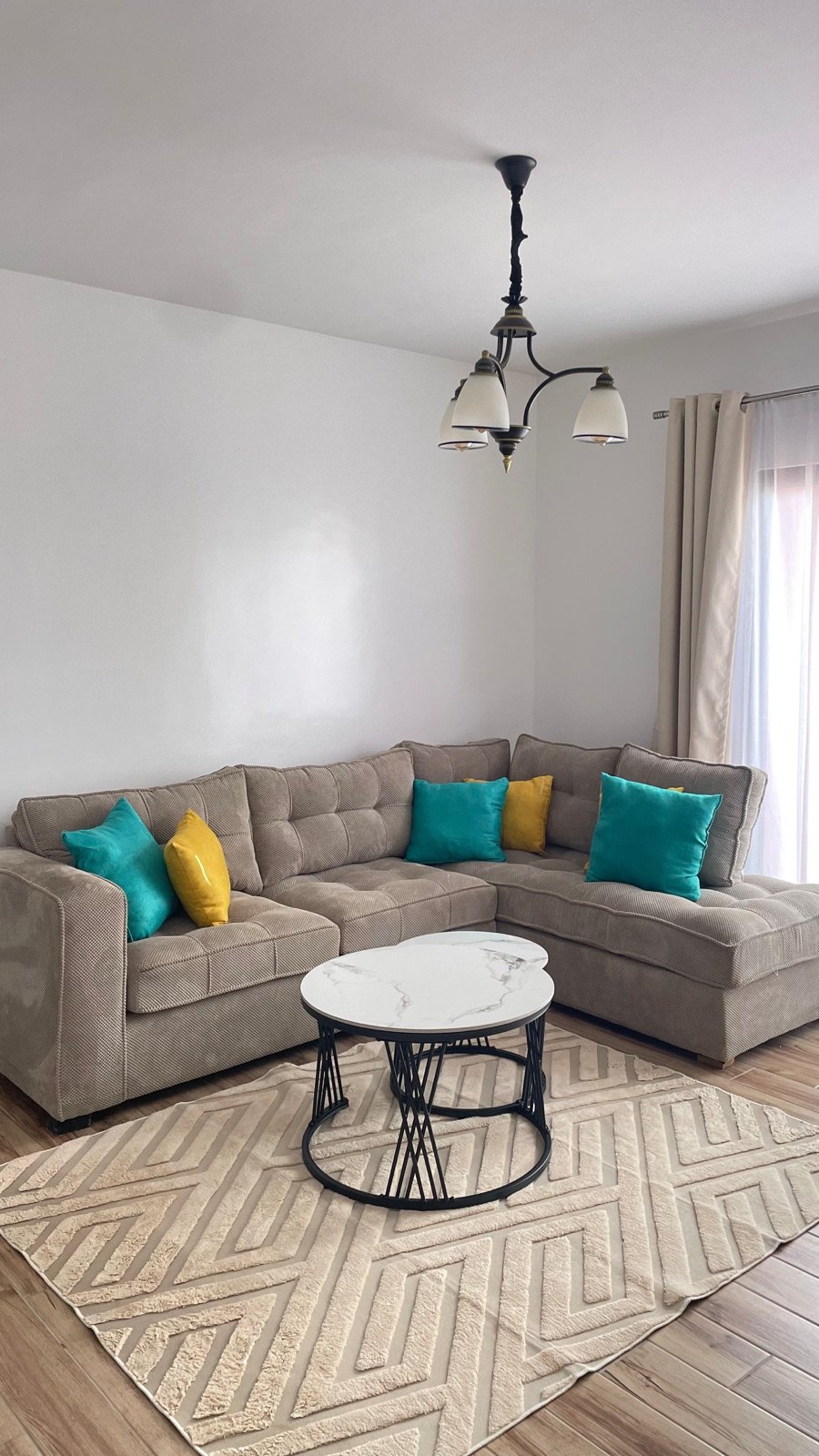 GL Luxe Suites living room with sectional sofa